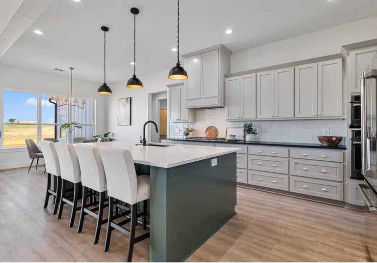 White kitchen with green island