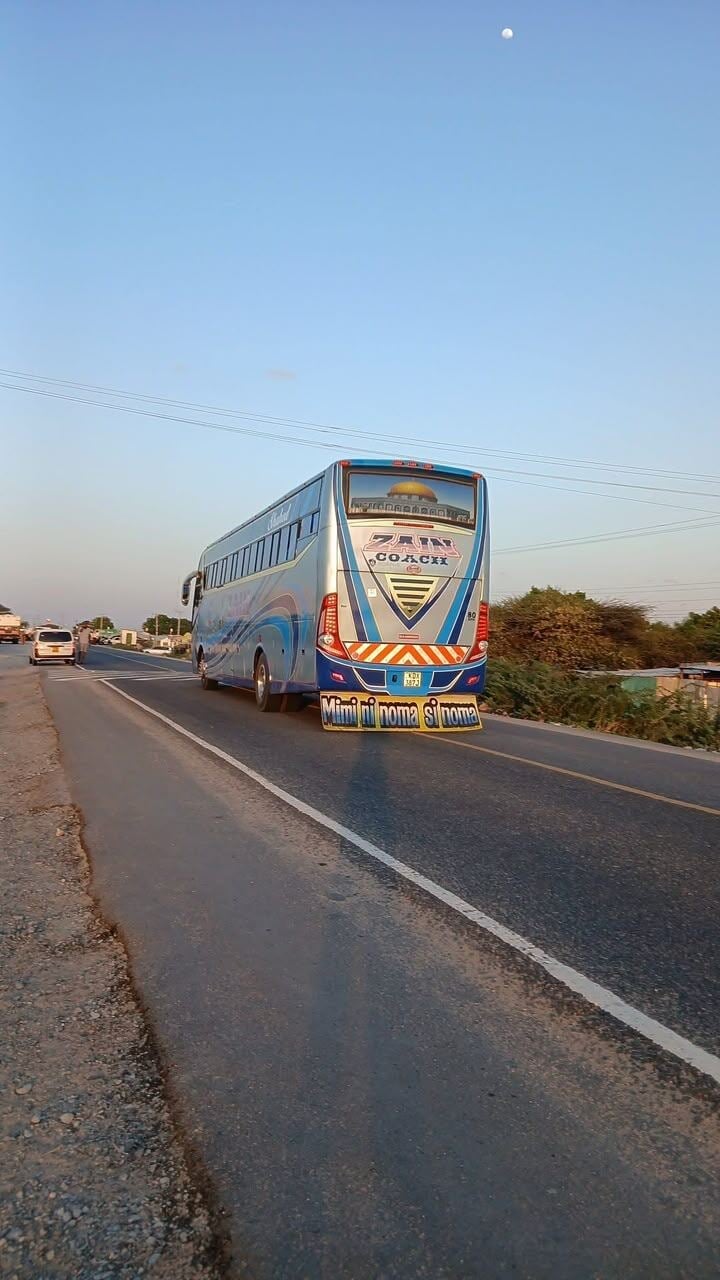 Zain Coach blue and white intercity coach on the highway