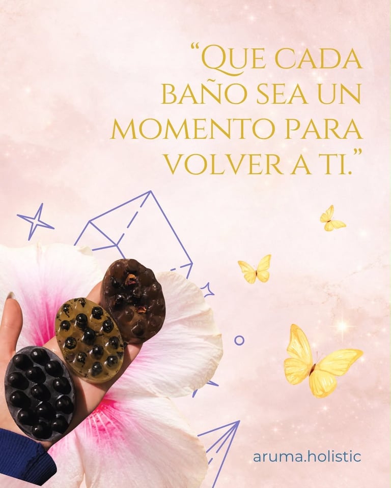 Hand holding three decorative bath brushes with pink tulle, surrounded by illustrated butterflies and stars with Spanish wellness quote.