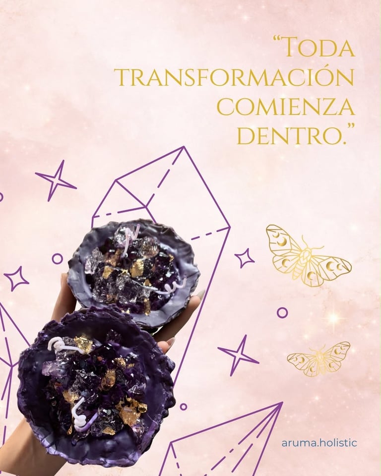 Hand holding two purple and gold crystal-filled spheres with text toda transformacion comienza dentro and decorative butterfly illustrations on pink background