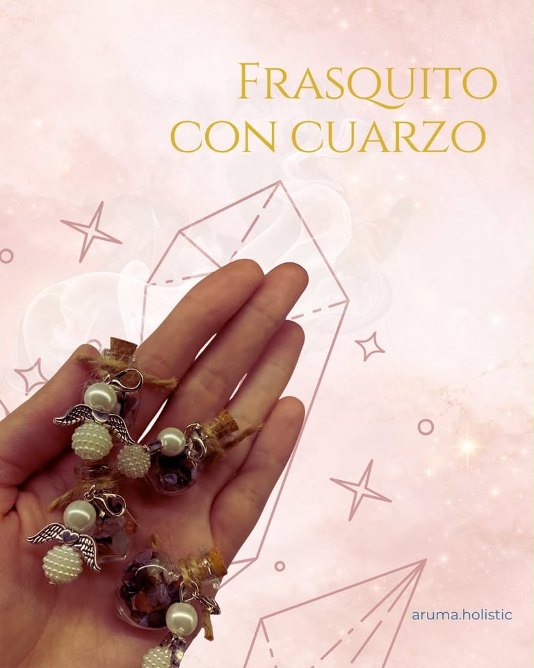 Hand holding decorative crystal charm bracelets with pearls and gemstones on pink background with stars and Spanish text Frasquito Con Cuarzo