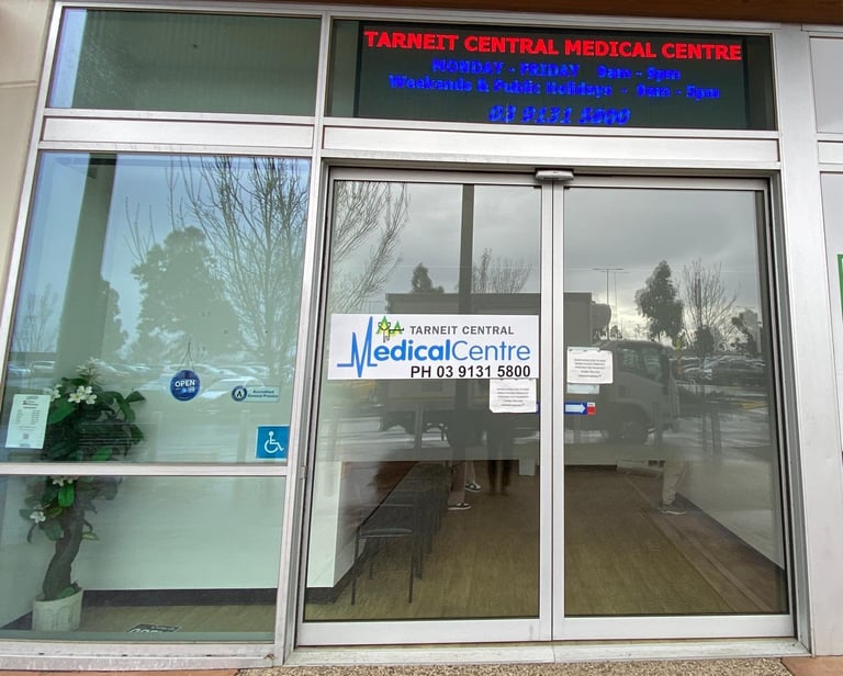Tarneit Central Medical Centre storefront with glass doors, signage, and accessibility symbol visible on the entrance window.