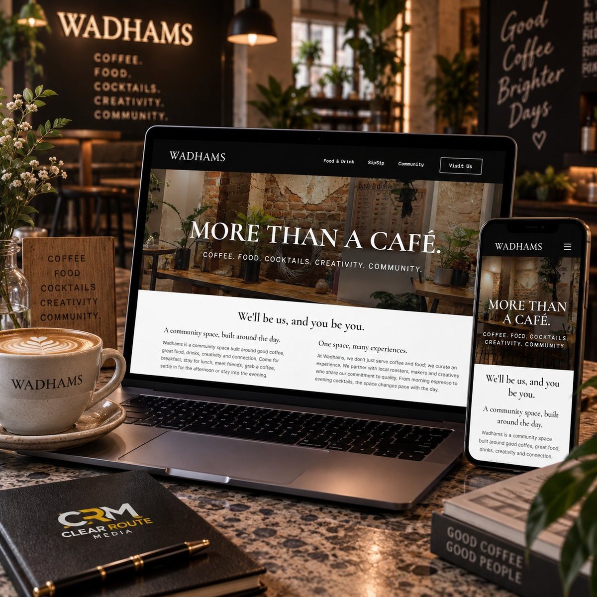 Wadhams cafe website displayed on laptop, tablet, and phone with coffee cup and branded materials on wooden desk