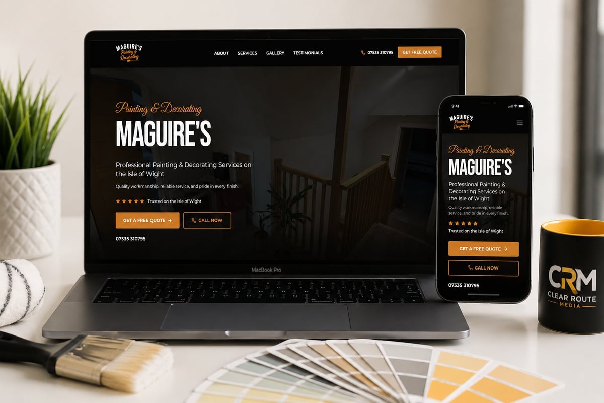 Maguires website displayed on laptop and smartphone mockup with paint samples and design tools on desk