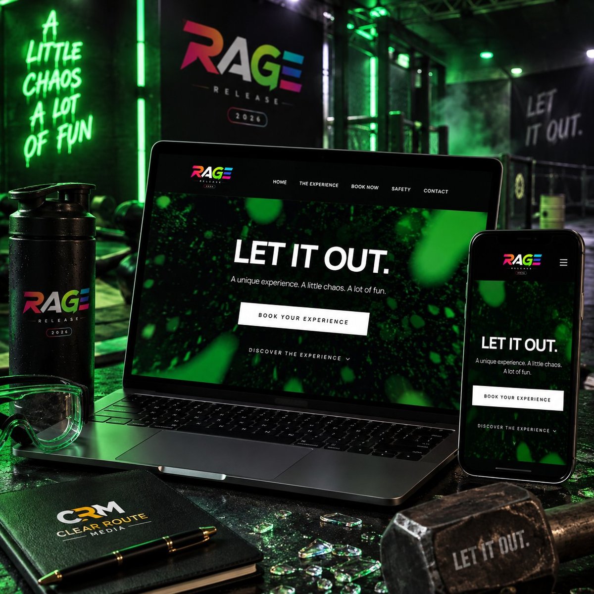 RAGE website displayed on laptop and smartphone with green neon lighting, black water bottle, and desk accessories