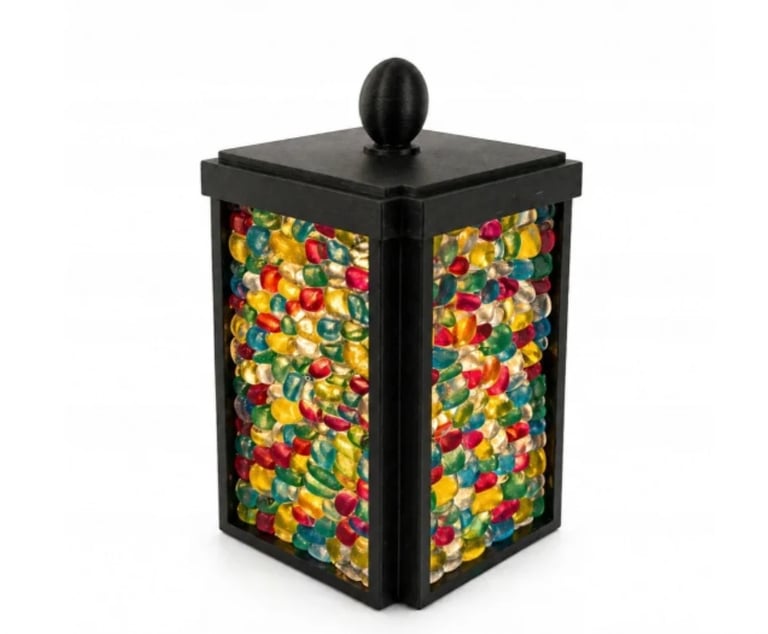 Black decorative box with colorful floral pattern panels and black knob finial on top