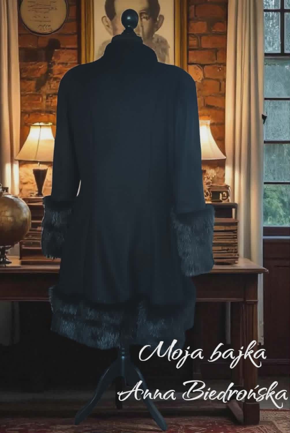 Back view of a black fur-trimmed coat displayed on a mannequin in an elegant interior with furniture and portraits