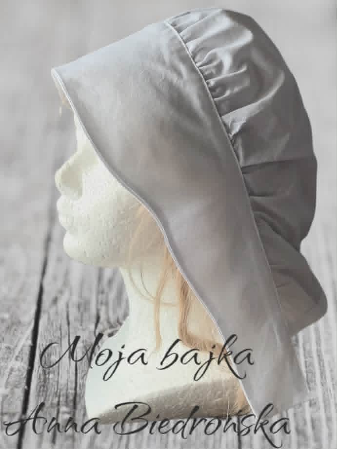 Woman wearing white headscarf and veil on wooden background with text overlay