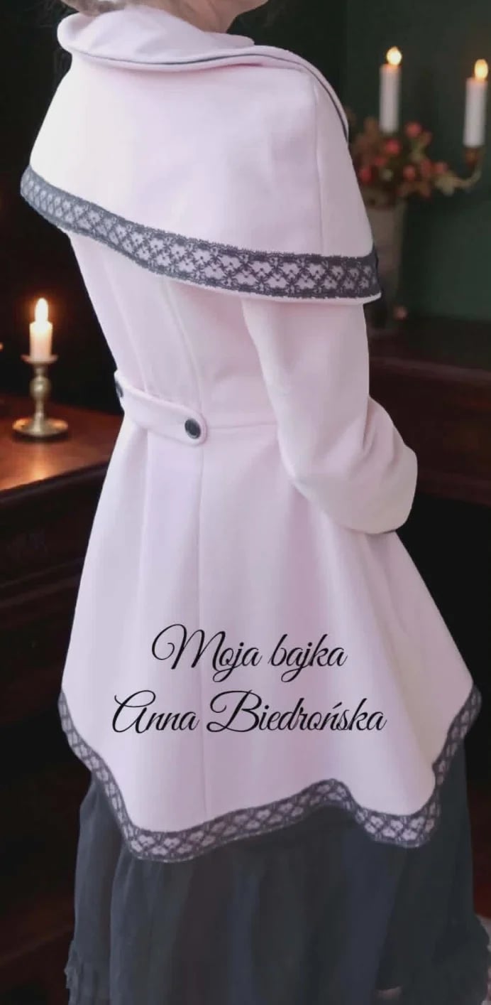 Person wearing white traditional shawl with gray lace trim and text overlay in festive setting with candles