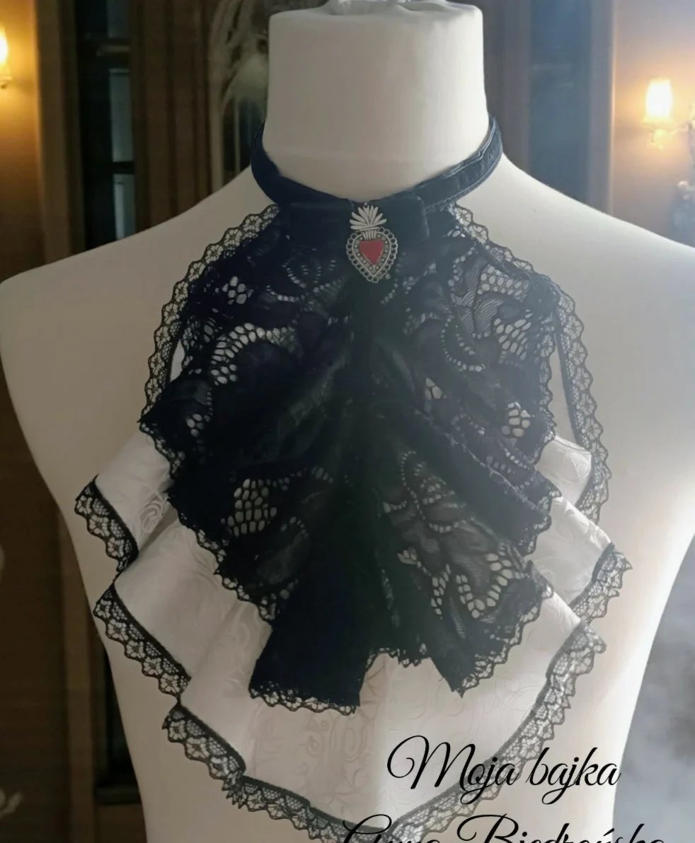Black lace choker and bow tie displayed on a mannequin with decorative trim details