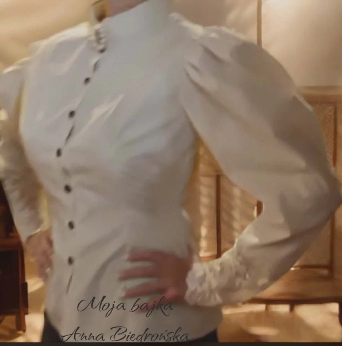 White button-up shirt on a dress form or mannequin displaying tailoring, with text overlay reading Moja bajka Anna Bedrosinska