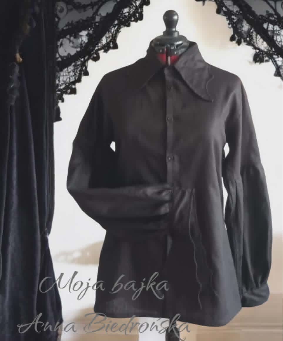 Back view of a black button-up blouse on a mannequin with lace trim detail and text overlay