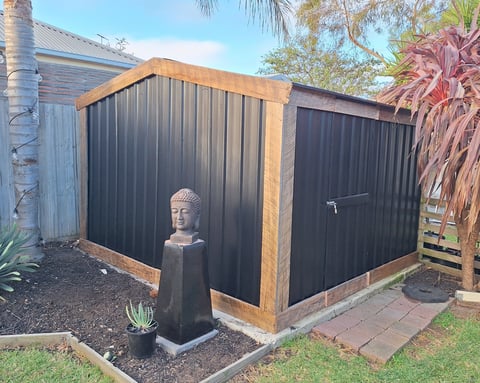Garden shed assembly - modern metal shed with timber frame installed by Geelong handyman in residential backyard