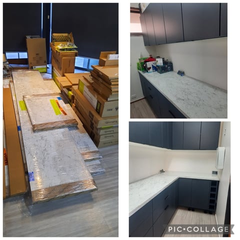 Kitchen renovation in progress showing layout with dark cabinets, marble countertops, and construction materials on floor