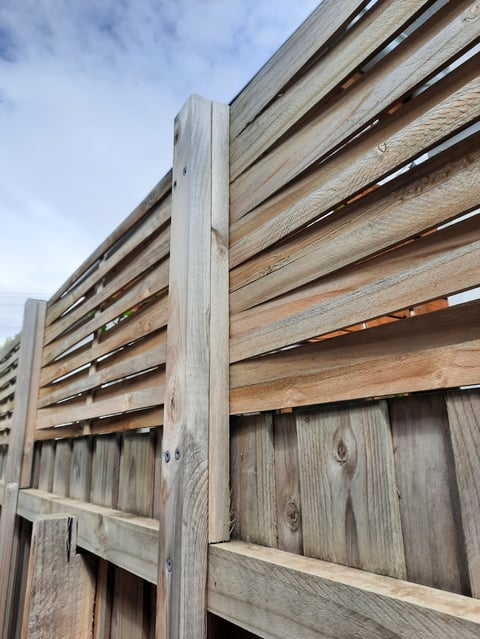 Weathered horizontal plank timber fence with vertical posts - fencing style reference for Home and Asset Management projects in Geelong