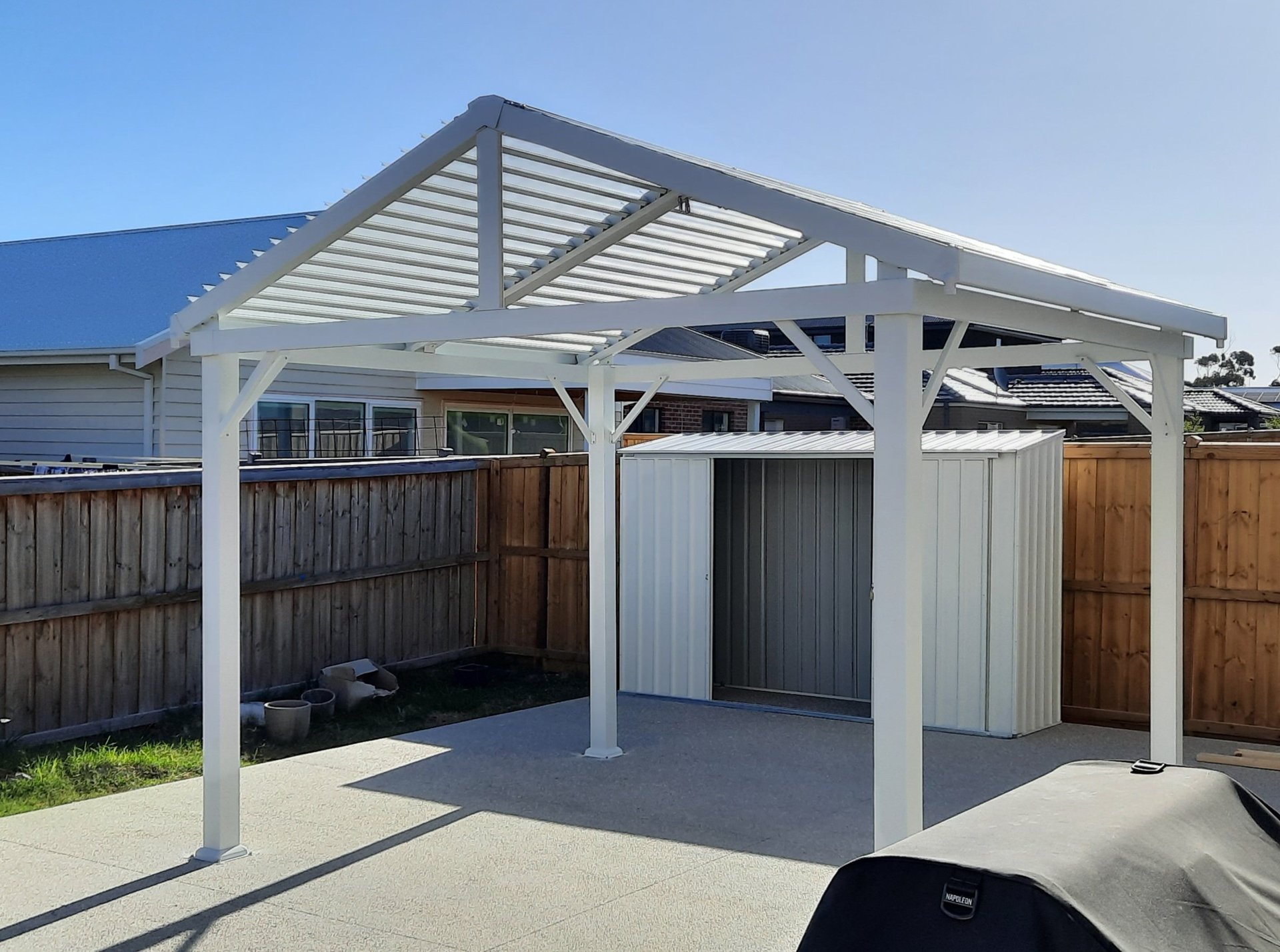 Modern aluminum slatted pergola installed by Home and Asset Management over a residential concrete patio in Geelong