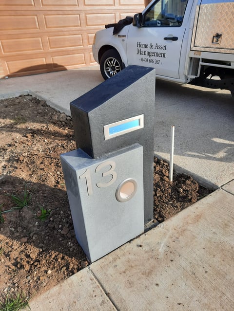 Custom concrete mailbox with house number 13 - outdoor project completed by Geelong handyman in residential driveway