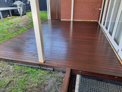 Timber decking repair - dark stained deck attached to brick home with support posts, Geelong decking maintenance project