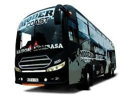 Modern Coast long-distance bus parked at a station