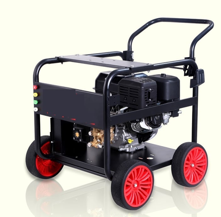Black and red pressure washer with gas engine on wheeled cart against white background