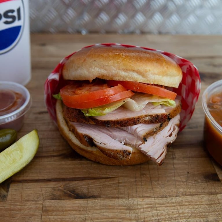 TLT sandwich — smoked turkey, lettuce and tomato on a bun
