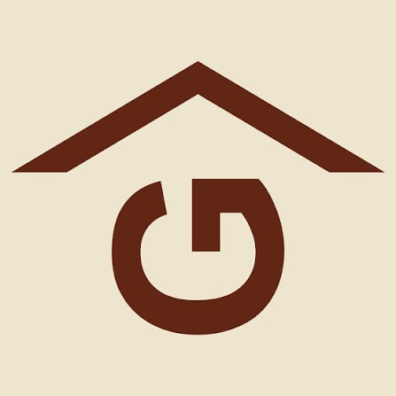 Brown Rafter G ranching heritage logo: a stylized G with a roof line above, set inside a circular mark