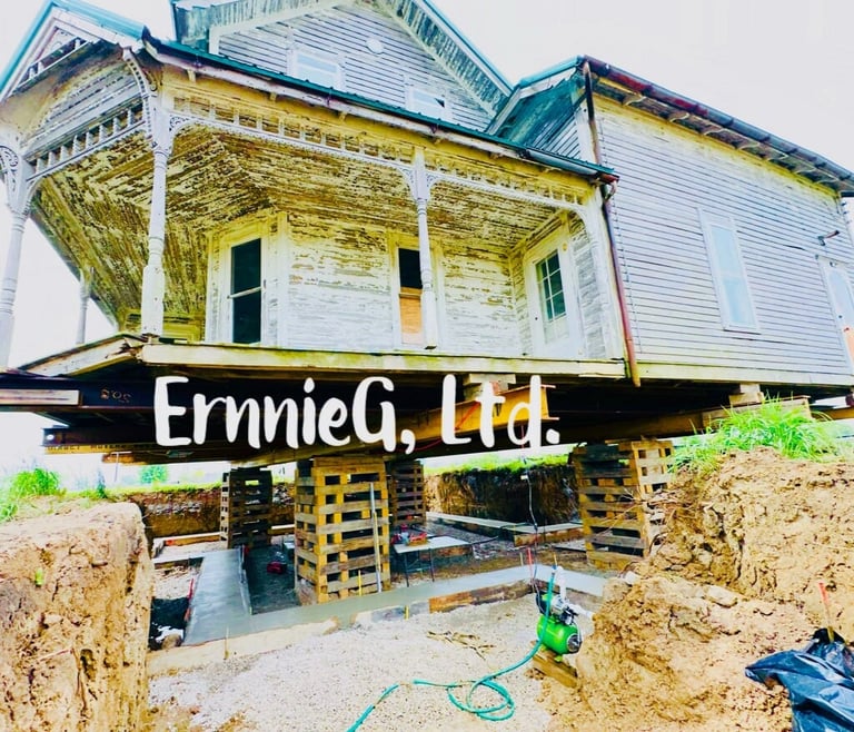 Elevated house on wooden and concrete foundation blocks during renovation by ErnnieG Masonry