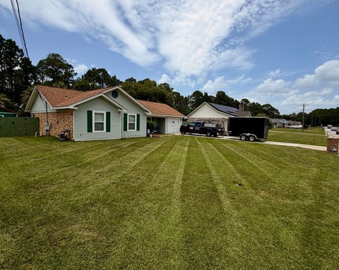 Jen's lawn mowed and striped for a clean, manicured look - after