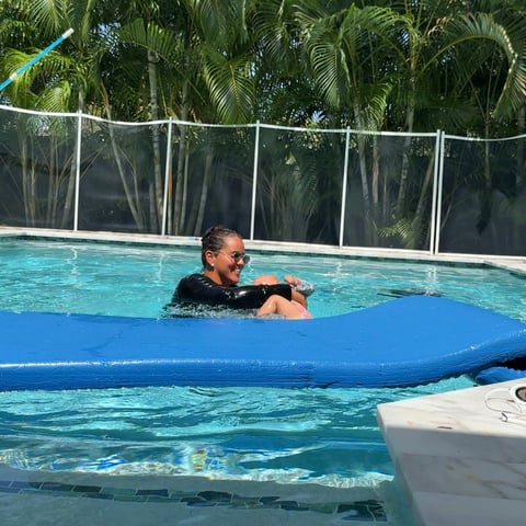 Infant swim lesson photo 10 — adult instructor teaching baby in a private pool