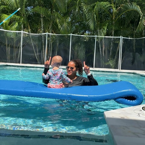 Infant swim lesson photo 3 — adult instructor teaching baby in a private pool