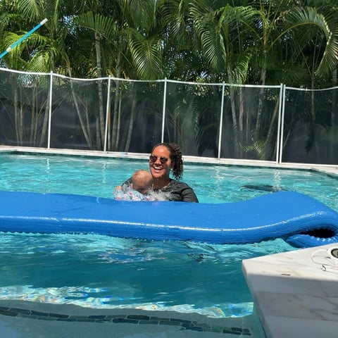 Infant swim lesson photo 8 — adult instructor teaching baby in a private pool