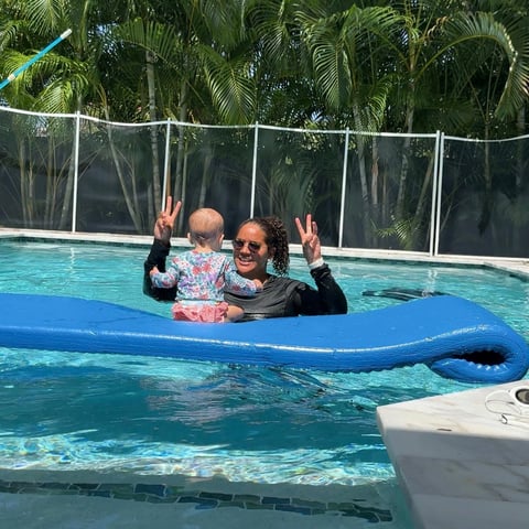 Infant swim lesson photo 5 — adult instructor teaching baby in a private pool