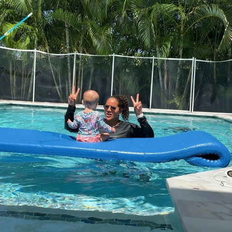 Infant swim lesson photo 4 — adult instructor teaching baby in a private pool