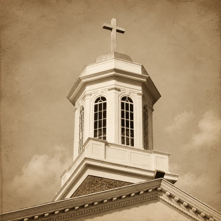 White church steeple with cross on top against sepia-toned sky, arched windows and octagonal cupola visible