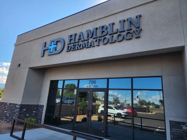Hamblin Dermatology medical office storefront with gray facade, glass doors and windows, and signage