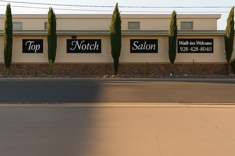 Storefront exterior of Top Notch Salon with tan stucco walls, cypress trees, and Walk-ins Welcome signage with phone number.