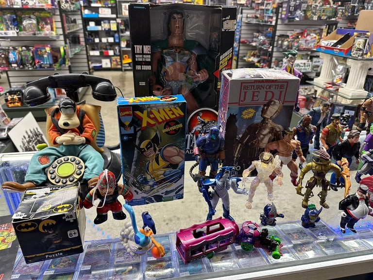 Display case filled with X-Men collectibles including action figures, comic books, merchandise, and memorabilia in a comic shop