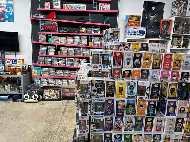 Collectibles store display with shelves of comics, trading cards, action figures, and pop culture memorabilia