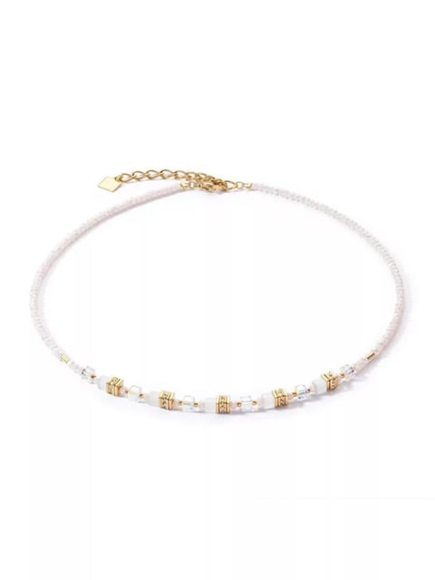 Delicate beaded bracelet with white beads and gold-tone spacer accents, featuring an adjustable chain closure.