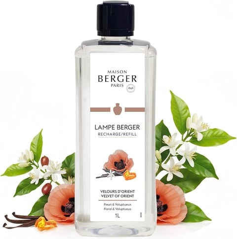 Maison Berger Paris Lampe Berger refill bottle with Velvet of Orient fragrance, surrounded by orange flowers and green leaves