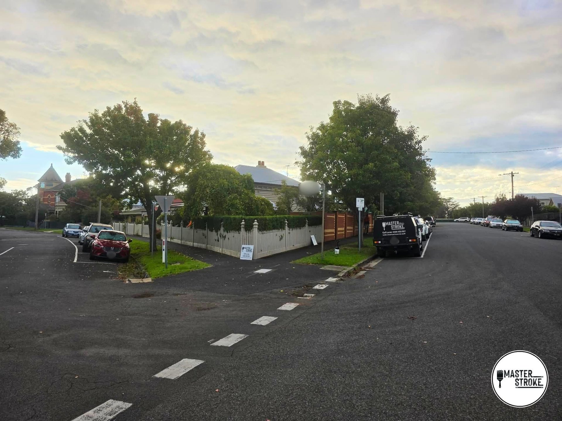 Geelong street scene with the Master Stroke van parked out front of a freshly painted home with white picket fence