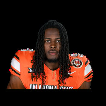 Portrait of a football player wearing an orange Oklahoma State uniform against a black background