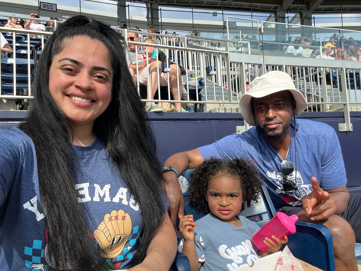 Coach Robert Byrd with his family at an outdoor sports venue
