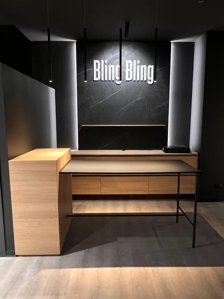 Bling Bling branded counter on black marble wall