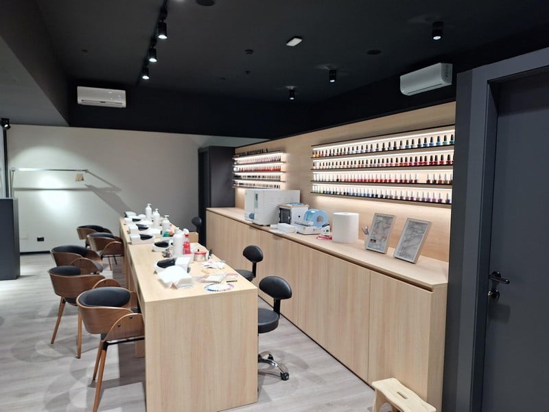 Modern nail salon interior with manicure stations