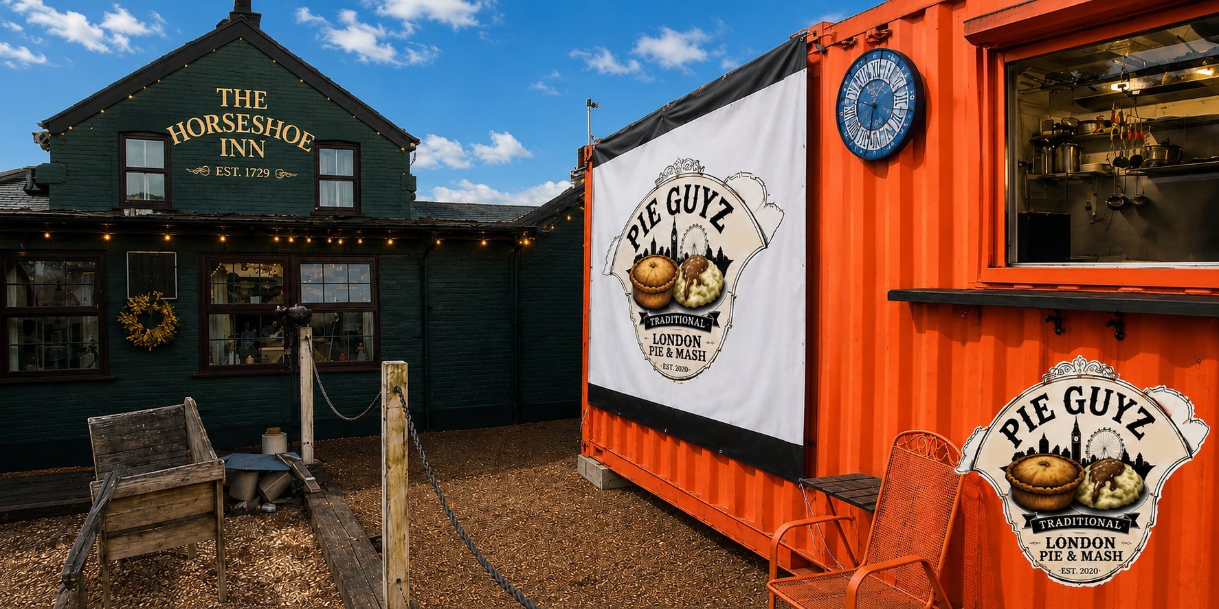 Green horseshoe inn building next to orange shipping container food vendor with Big Guys branding on gravel ground