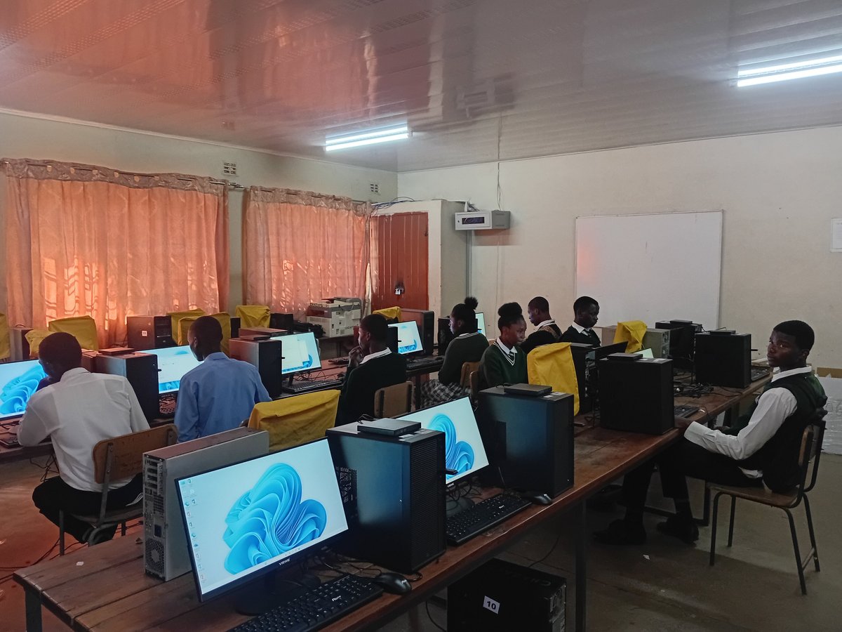 Computer lab classroom with students working at desktop computers