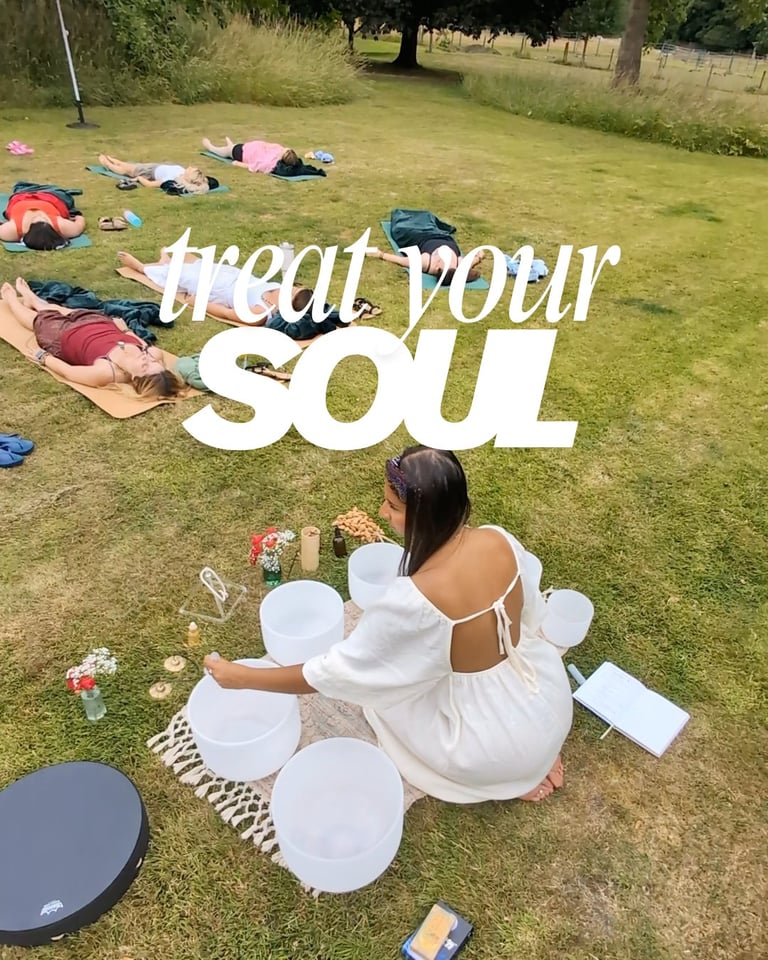 Woman in white dress meditating in grass field with treat your soul text overlay