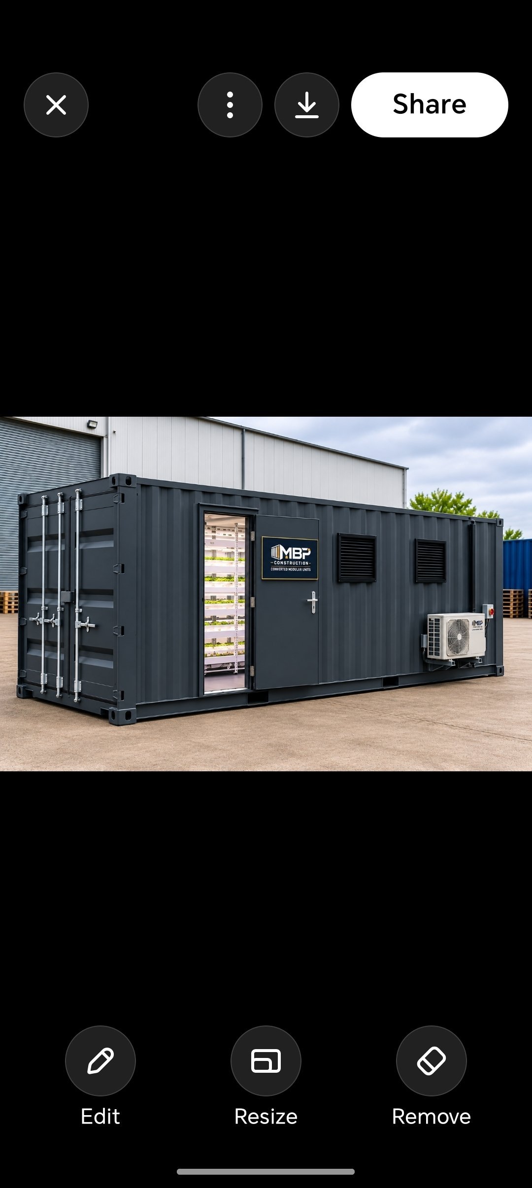 Dark metal shipping container converted into a modular office or commercial space with door, ventilation, and AC unit on concrete ground