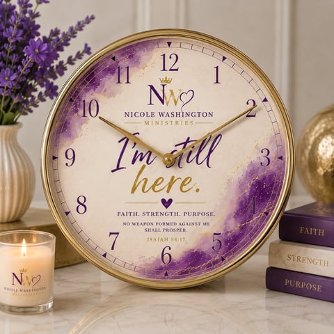 Decorative wall clock with purple watercolor design reading Im still here, featuring faith, strength, purpose message